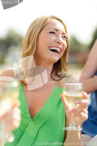 Image of laughing woman with wine glass