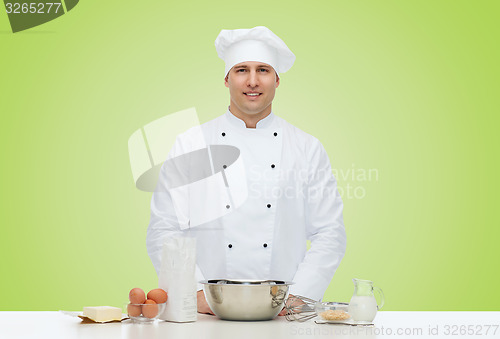 Image of happy male chef cook baking