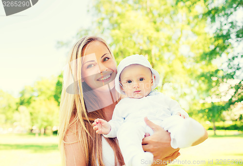 Image of happy mother with little baby in park