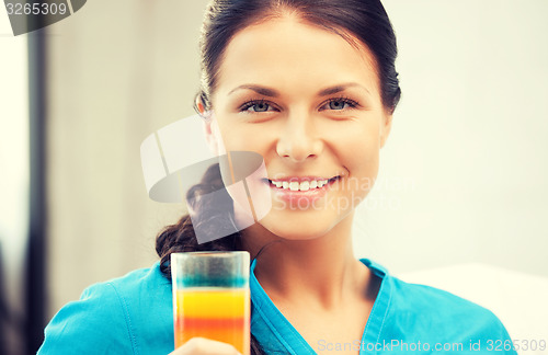 Image of beautiful woman with glass of juice
