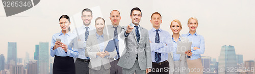 Image of group of happy business people pointing at you