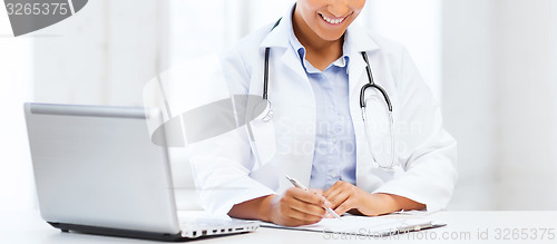 Image of female doctor with laptop pc