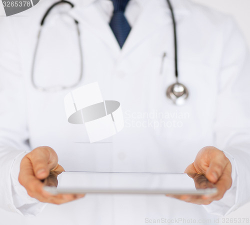 Image of male doctor holding tablet pc and stethoscope