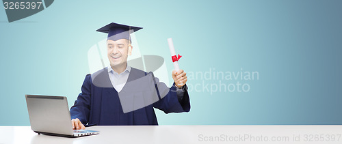 Image of smiling adult student in mortarboard with diploma