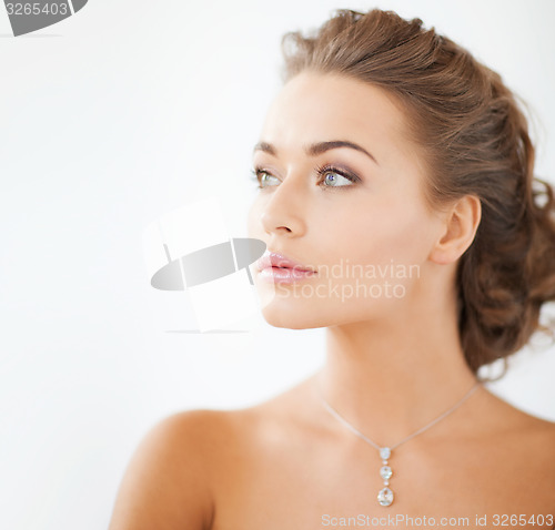 Image of woman wearing shiny diamond necklace