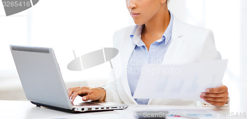 Image of businesswoman working with computer in office