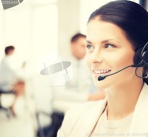 Image of female helpline operator in call center