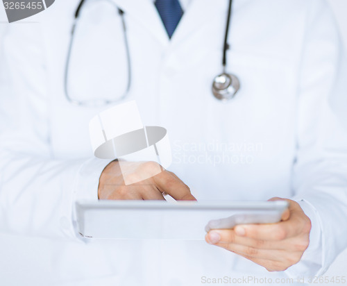 Image of male doctor holding tablet pc