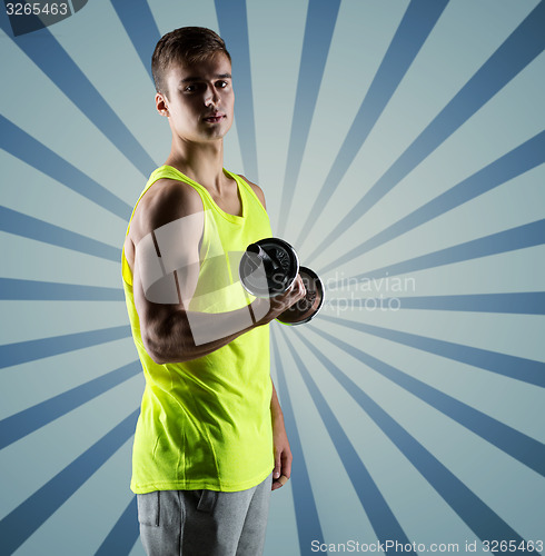 Image of young man with dumbbell flexing biceps