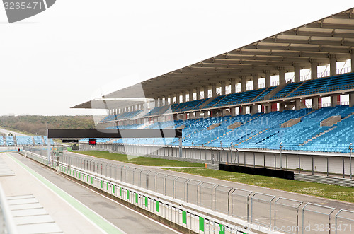 Image of empty speedway and bleachers on stadium
