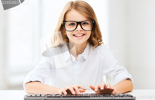 Image of student girl with keyboard