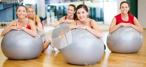 Image of group of people working out in pilates class