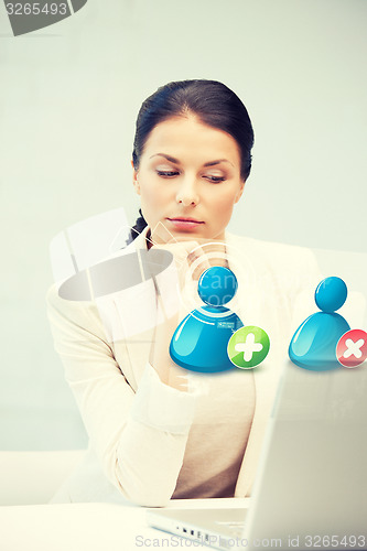 Image of woman with laptop and contact icon