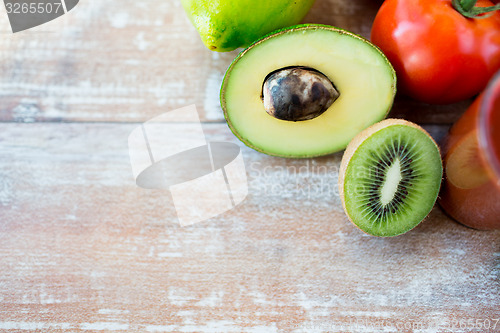 Image of close up of fresh fruits and juice glass on table