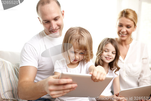 Image of happy family with tablet pc computers at home