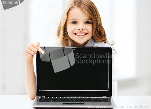 Image of girl with laptop pc at school