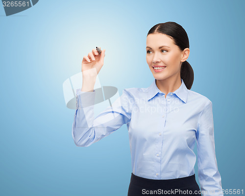 Image of businesswoman writing something in air