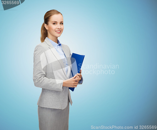 Image of smiling businesswoman holding folder