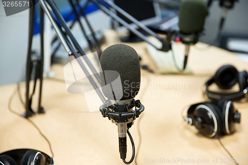 Image of microphone at recording studio or radio station