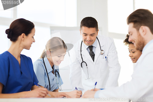 Image of group of happy doctors meeting at hospital office