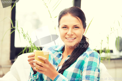 Image of lovely housewife with mug