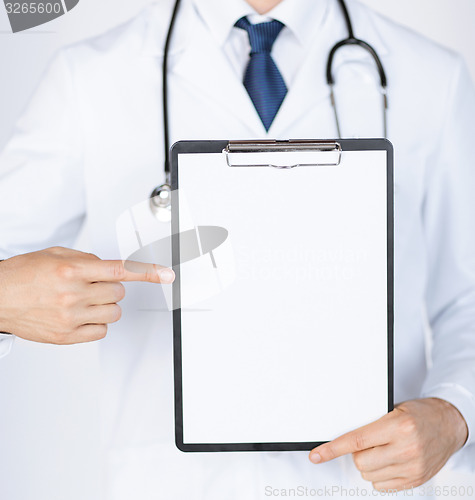 Image of doctor pointing at blank white paper
