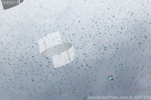 Image of close up of wet rear car glass