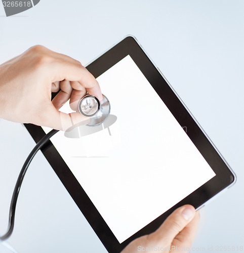 Image of doctor with stethoscope and tablet pc