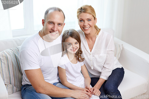 Image of happy parents with little daughter at home