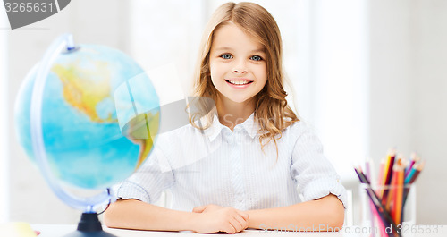 Image of student girl with globe at school