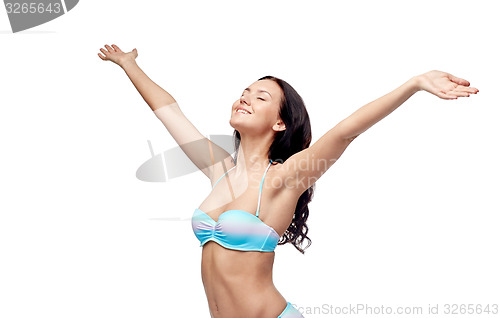 Image of happy woman in bikini swimsuit with raised hands