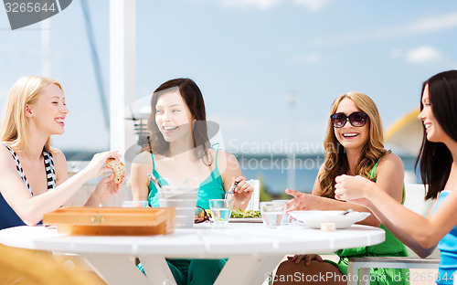 Image of girls in cafe on the beach