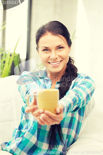 Image of lovely housewife with mug