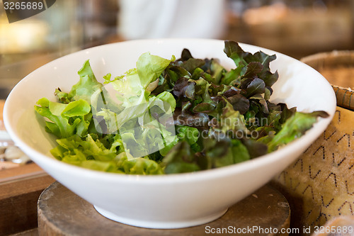 Image of bowl of green salad lettuce at asian restaurant