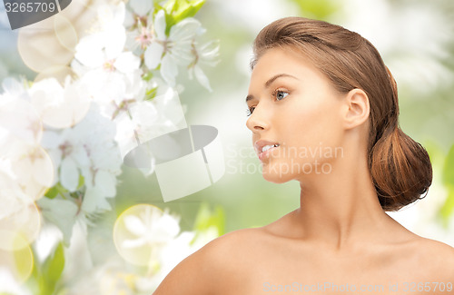 Image of beautiful young woman face looking aside