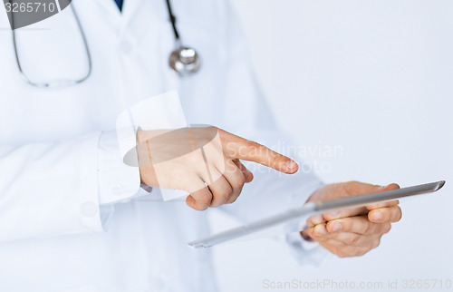 Image of male doctor holding tablet pc