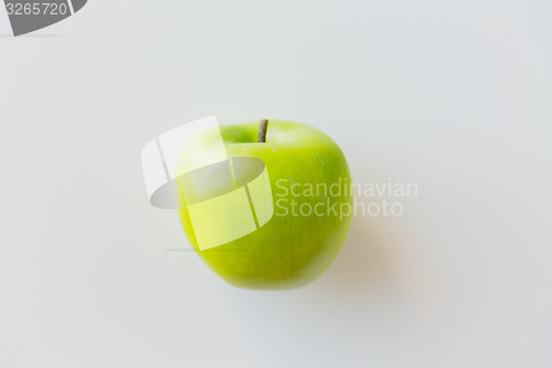 Image of ripe green apple over white