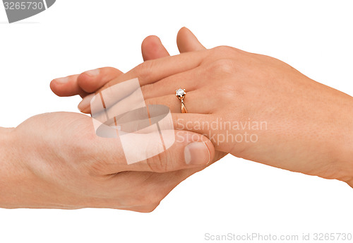 Image of man puts wedding ring on woman hand