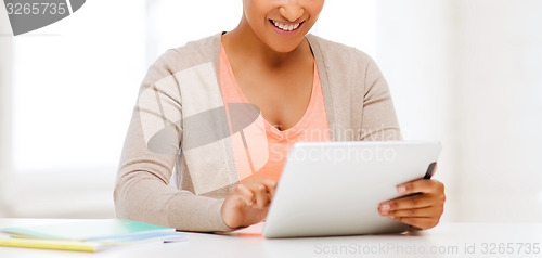 Image of smiling student girl with tablet pc