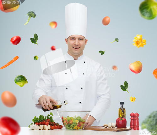 Image of happy male chef cook cooking food