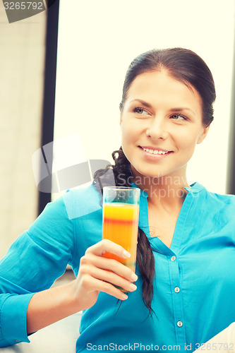 Image of beautiful woman with glass of juice