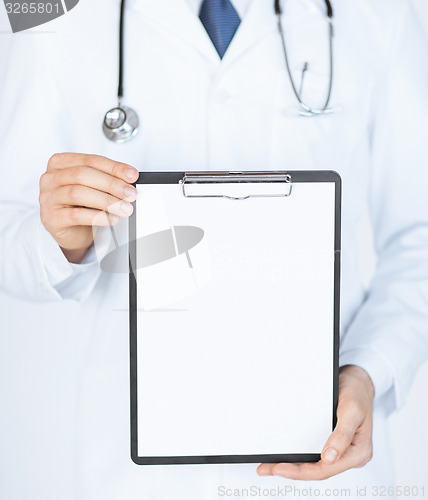 Image of doctor holding blank white paper
