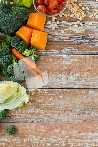 Image of close up of ripe vegetables on wooden table