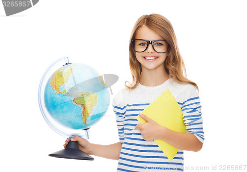 Image of smiling child with globe, notebook and eyeglasses