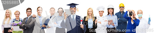 Image of happy bachelor with diploma over professionals