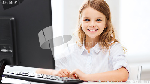 Image of student girl with computer at school