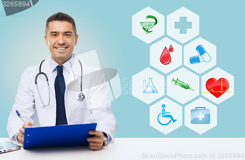 Image of happy doctor with clipboard and medical icons