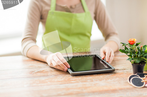 Image of close up of woman or gardener with tablet pc