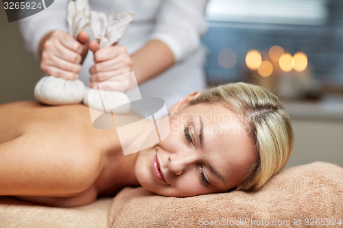 Image of close up of woman lying on massage table in spa