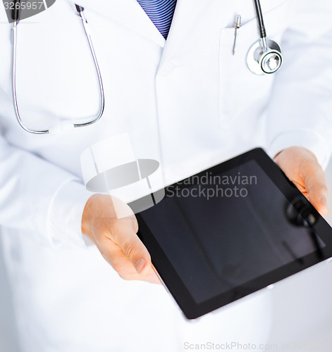 Image of male doctor holding tablet pc